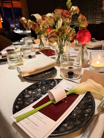 Calla lilies, menus and flowers on the table